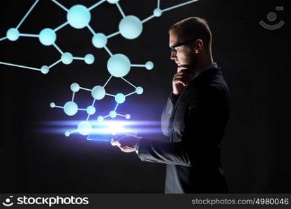 business, people, science, biology and future technology concept - close up of businessman with transparent tablet pc computer and virtual molecule over black background. close up of businessman with transparent tablet pc