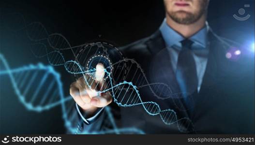 business, people, science, future technology and genetics concept - close up of businessman touching virtual dna molecule projection over dark background. businessman with virtual dna molecule projection