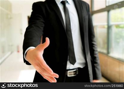Business people shake hand to deal with you
