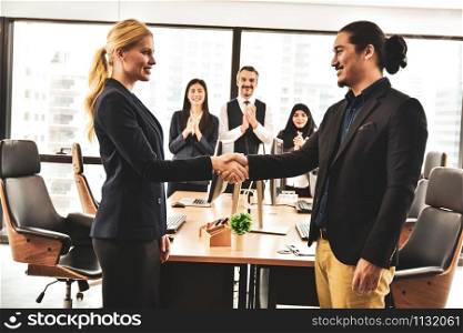 Business people shake hands success project in meeting room with business team