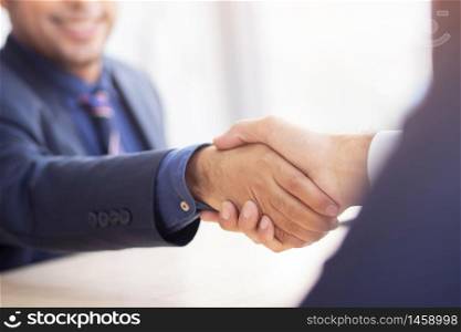 Business people shake hands to do new business together