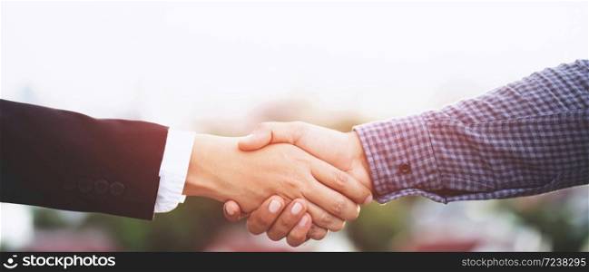 Business people shake hands together to do new business