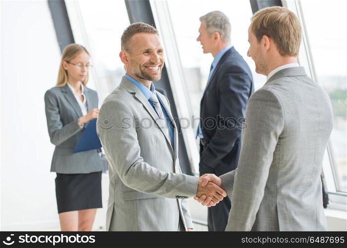 Business people shaking hands. Business people shaking hands, finishing up a meeting