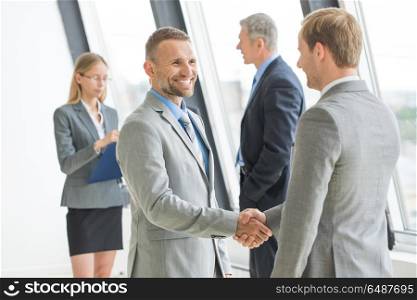 Business people shaking hands. Business people shaking hands, finishing up a meeting
