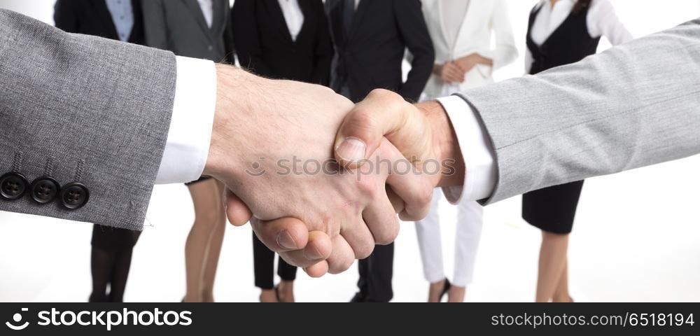 Business people shaking hands. Business people shaking hands, their team standing on background