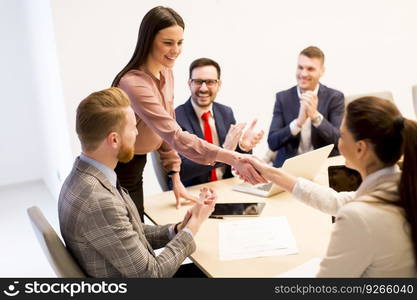 Business people shaking hands finishing up a meeting  in office