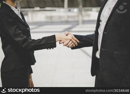 Business people shaking hands, finishing up meeting deals. Business concept.. Business people shaking hands, finishing up meeting deals. Busin