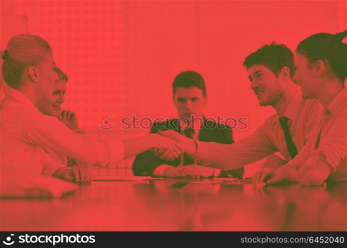 business people shaking hands make deal and sign contract in bright modern officeduo tone