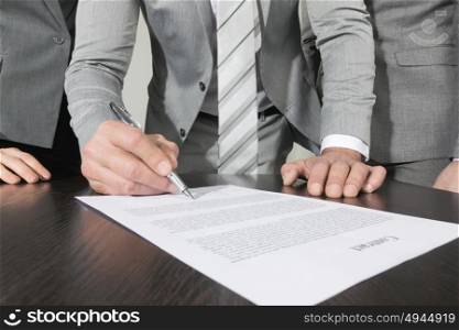 Business people sign contract. Group of business people sign a contract finishing deal