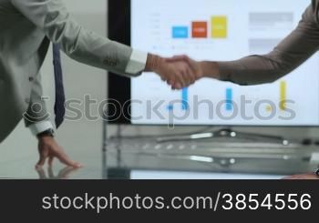 Business people signing contract during corporate meeting and shaking hands. Dolly shot, 18of20