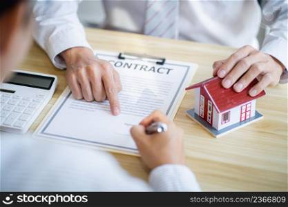 Business people signing contract making deal with real estate agent Concept for consultant home insuranceReal estate investment Property insurance security. Real estate agent offer house.