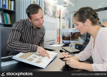 business people sitting at desk in office