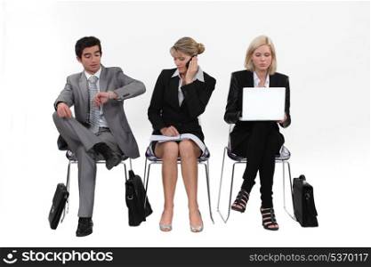 Business people sitting in a row