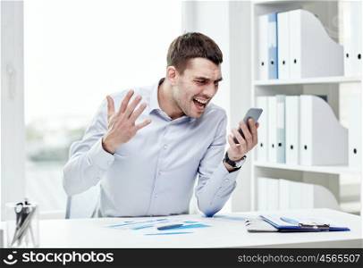 business, people, stress and technology concept - close up of angry businessman with smartphone shouting. close up of businessman with smartphone