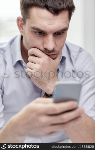 business, people, stress and technology concept - close up of businessman with smartphone