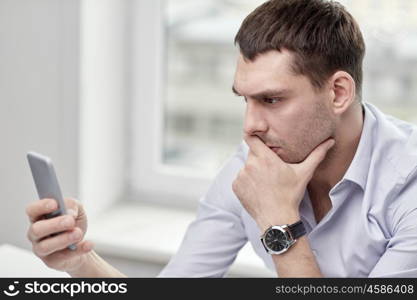 business, people, stress and technology concept - close up of businessman with smartphone