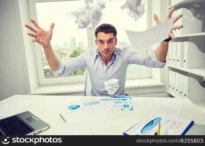 business, people, stress, emotions and fail concept - angry businessman throwing papers in office