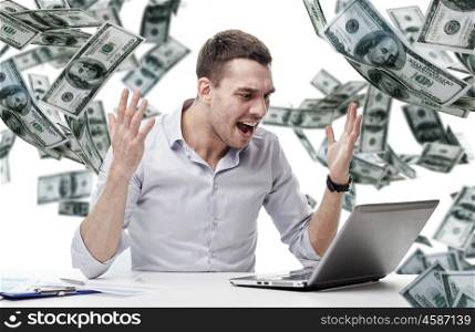 business, people, stress, fail and technology concept - angry businessman with laptop computer and papers shouting over falling money background