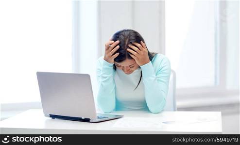business, people, stress, fail and technology concept - despaired businesswoman with laptop computer and papers in office