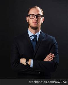 business, people, style and office worker concept - businessman in suit and eyeglasses over black background