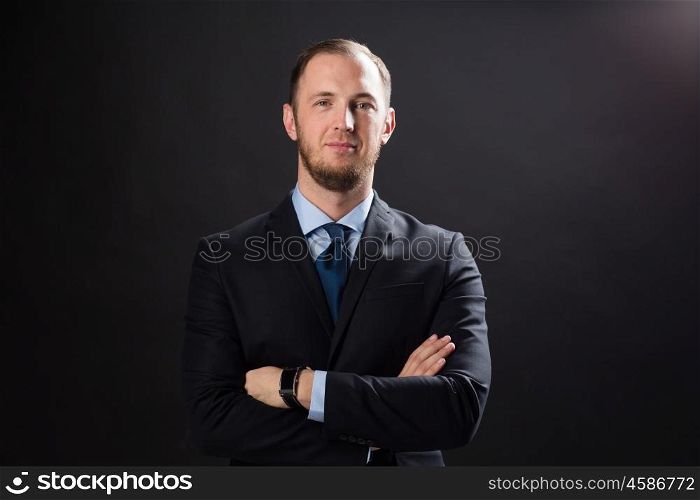 business, people, style and office worker concept - businessman in suit over black background