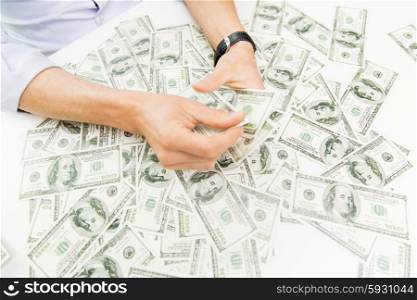 business, people, success and fortune concept - close up of male businessman hands with dollar money