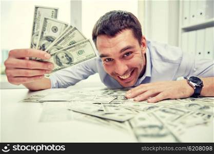 business, people, success and fortune concept - happy businessman with heap of dollar money in office