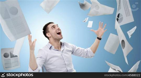 business, people, success concept - businessman with falling papers over blue background