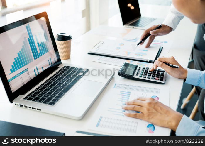 Business People Talking Discussing with coworker planning analyzing financial document data charts and graphs in Meeting and successful teamwork Concept