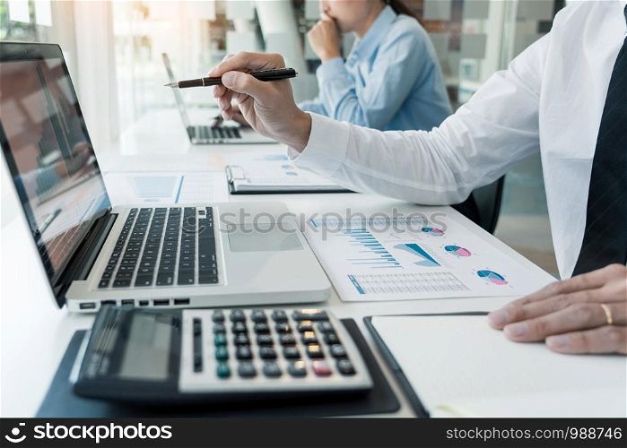 Business People Talking Discussing with coworker planning analyzing financial document data charts and graphs in Meeting and successful teamwork Concept