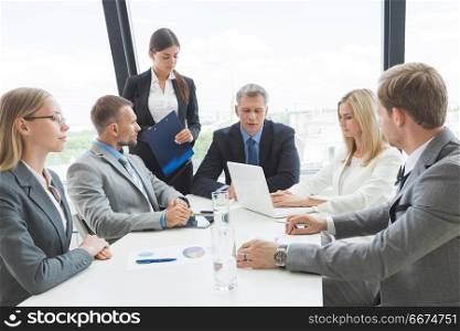 Business people team at meeting. Business people team at meeting working documents together in office