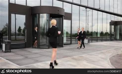 Business people team walking outdoors near office building
