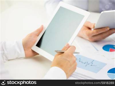 business, people, technology, advertisement and teamwork concept - close up of businessman hands with tablet pc computer blank screen at office