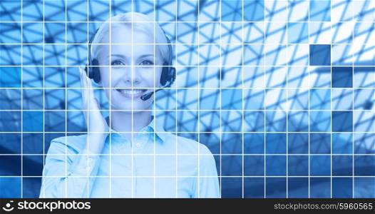 business, people, technology and communication concept - happy female helpline operator in headset over blue grid background