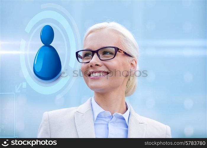business, people, technology and communication concept - young smiling businesswoman in eyeglasses and virtual screen with user icon outdoors