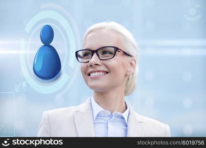 business, people, technology and communication concept - young smiling businesswoman in eyeglasses and virtual screen with user icon outdoors