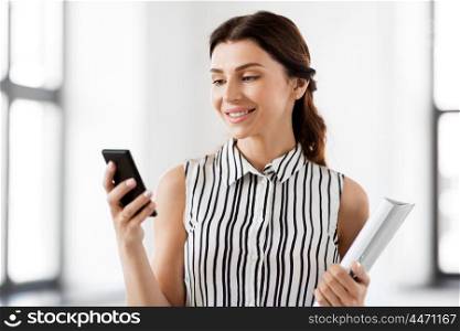 business people, technology and corporate concept - businesswoman or realtor with smartphone and folder at office. businesswoman with smartphone and folder at office. businesswoman with smartphone and folder at office