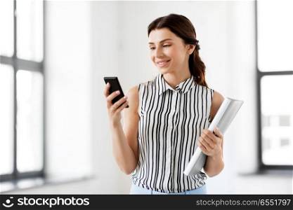 business people, technology and corporate concept - businesswoman or realtor with smartphone and folder at office. businesswoman with smartphone and folder at office. businesswoman with smartphone and folder at office