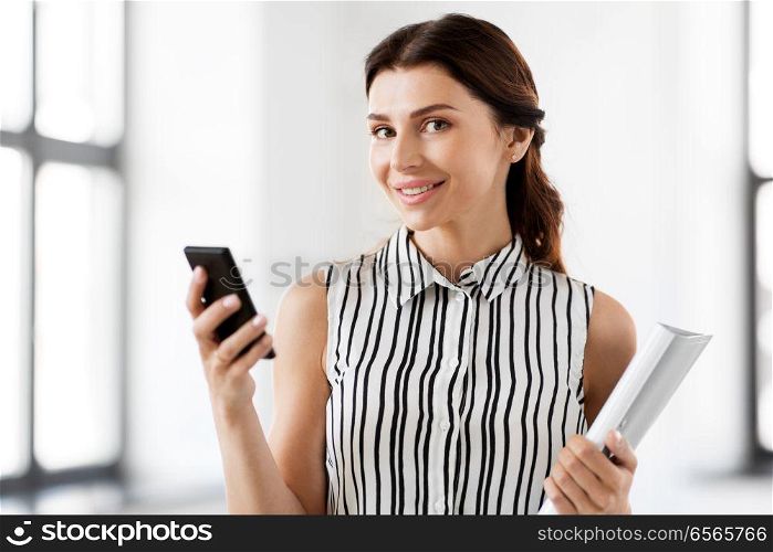 business people, technology and corporate concept - businesswoman or realtor with smartphone and folder at office. businesswoman with smartphone and folder at office