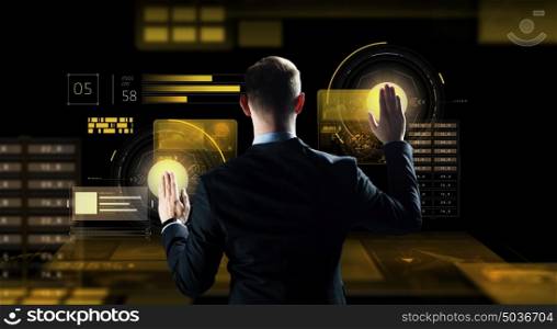 business, people, technology and cyberspace concept - businessman in suit working with virtual reality screen over dark background. businessman touching virtual screen
