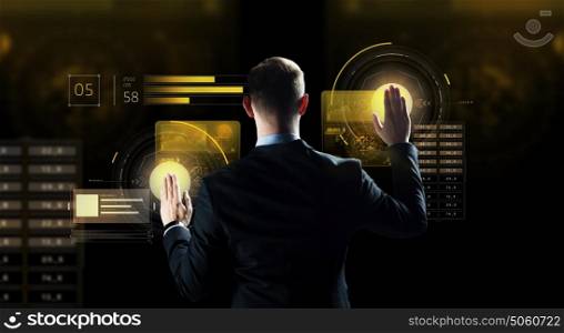 business, people, technology and cyberspace concept - businessman in suit working with virtual reality screen over dark background. businessman touching virtual screen