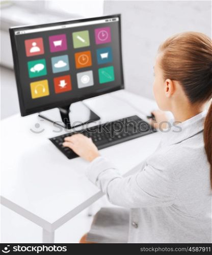 business, people, technology and education concept - businesswoman or student girl with menu icons on computer screen sitting at office table