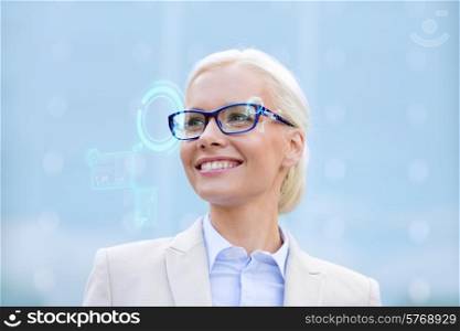 business, people, technology and education concept - young smiling businesswoman in eyeglasses with virtual screens hologram outdoors