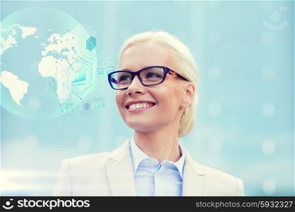 business, people, technology and education concept - young smiling businesswoman in eyeglasses with virtual screens and globe hologram outdoors