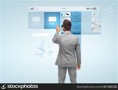 business, people, technology and internet concept - businessman touching e-mail virtual projection from back