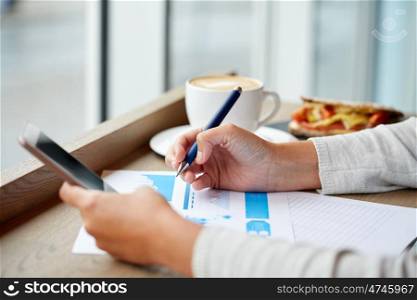 business, people, technology and lifestyle concept - woman with smartphone chart at cafe