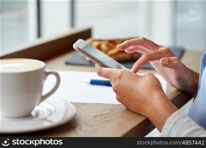 business, people, technology and lifestyle concept - woman with smartphone, coffee and food texting message at cafe