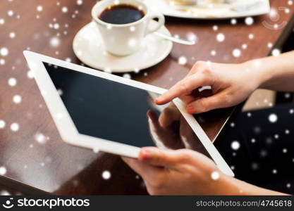 business, people, technology and lifestyle concept - woman with tablet pc computer and coffee over snow