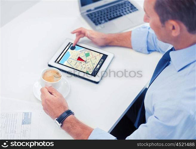 business, people, technology and navigation concept - businessman with gps navigator map on tablet pc screen drinking coffee in office