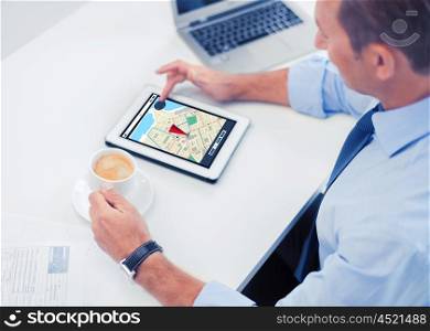 business, people, technology and navigation concept - businessman with gps navigator map on tablet pc screen drinking coffee in office